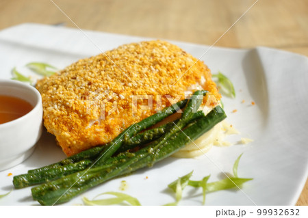 Fish fillet , chips and potato mash on table  99932632