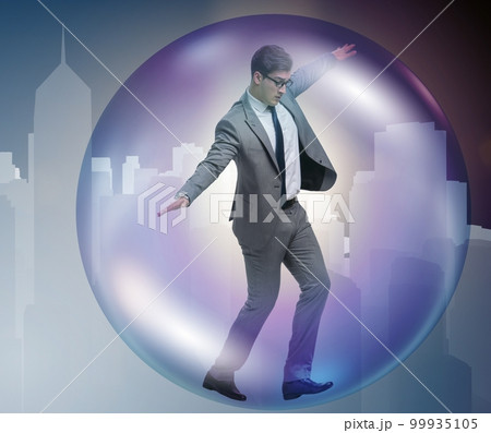 Businessman flying inside the bubble Businessman flying inside the bubble 99935105