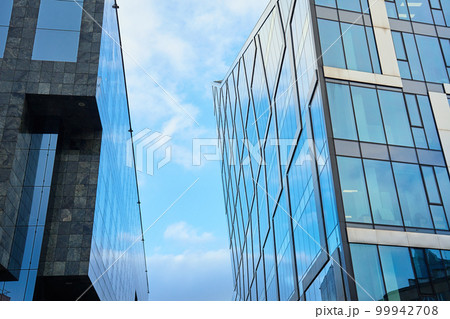 Modern office building glass facade. Skyscraper exterior. Architecture details. 99942708
