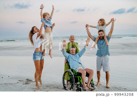 Portrait of multi generations family with little kids at sea in exotic country. 99943208