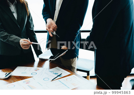 Business group people meeting and discuss to come up with conclusions on market, investment and marketing planning based on the financial budget provided by the company. Business group people meeting and discuss to come up with conclusions on market, investment and marketing planning based on the financial budget provided by the company. 99945863