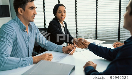 Commercial, agreement deal signed by competent people and shake hands. 99946522