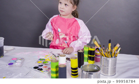 Kids papercraft. Painting empty toilet paper rolls with acrylic paint to create paper bugs. Kids papercraft. Painting empty toilet paper rolls with acrylic paint to create paper bugs. 99958784