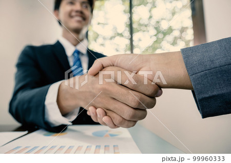hands shake after business office executives are interviewing job applicants in the meeting room 99960333