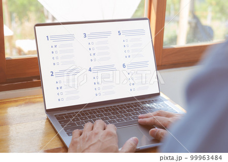 Questionnaire online with checkboxes. A man passing online exam. Evaluation, Online survey online exam Choosing the right answer in the exam, Test questions. Filling out online survey form business. 99963484