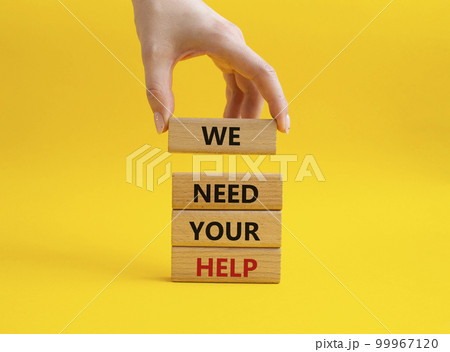 We need your help symbol. Wooden blocks with words We need your help. Beautiful yellow background. Businessman hand. Business and We need your help concept. Copy space. 99967120