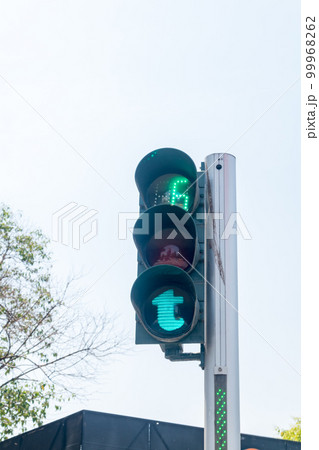 Green pedestrian traffic light in capital of Albania. 99968262