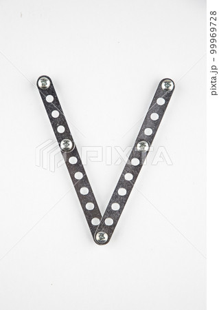 Letter V of English alphabet from Children's metal designer kit Letter V of English alphabet from Children's metal designer kit 99969728