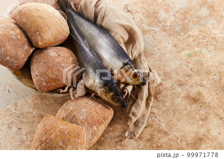 Catholic still life of five loaves of bread and two fish Catholic still life of five loaves of bread and two fish 99971778