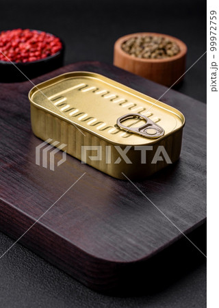 Metal aluminum can of canned sardines in oil with spices and salt 99972759