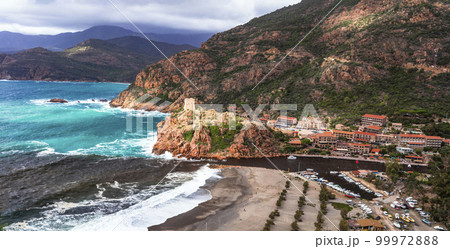 Corsica island beaches and nature scenery. Tower of Portu - historic Genoese tower and beach in village Ota in west of the island. Franc 99972888