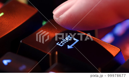 Man finger hovers over the Enter key for a few seconds before deciding to press it. Yes or no concept. Person is in doubt whether to press the enter key or not. Heavy decision do it or not. Man finger hovers over the Enter key for a few seconds before deciding to press it. Yes or no concept. Person is in doubt whether to press the enter key or not. Heavy decision do it or not. 99978677