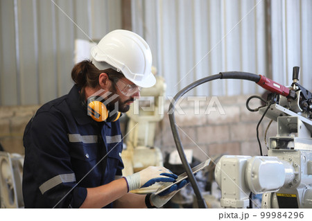engineer checking auto parts in factory engineer checking auto parts in factory 99984296