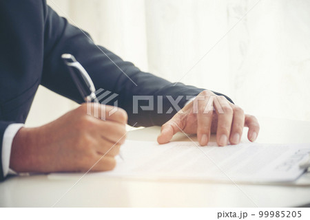 Asian business man using pen signing on new contract to starting projects in conference room. Close up manager businessman hands sign contract working meeting. Business agreement concepts. 99985205