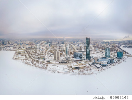 Yekaterinburg city with Buildings of Regional Government and Parliament, Dramatic Theatre, Iset Tower, Yeltsin Center, panoramic view at winter sunset. 99992145