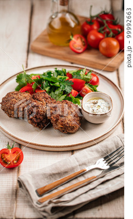Russian beef cutlets with sauce and salad 99992663