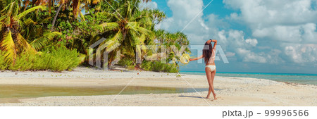 Beach travel luxury paradise private island woman traveller relaxing walking on remote beach in the Rangiroa atoll, Tuamotu islands, French Polynesia. Bikini girl on cruise excursion. Panoramic banner Beach travel luxury paradise private island woman traveller relaxing walking on remote beach in the Rangiroa atoll, Tuamotu islands, French Polynesia. Bikini girl on cruise excursion. Panoramic banner 99996566