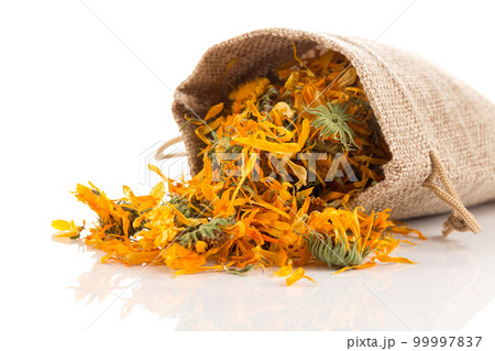 Calendula flowewr tea isolated on white Calendula flowewr tea isolated on white 99997837