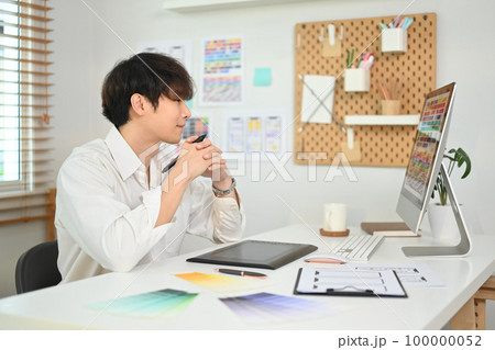 Professional web developer creating website wireframe sketches at modern creative office Professional web developer creating website wireframe sketches at modern creative office 100000052