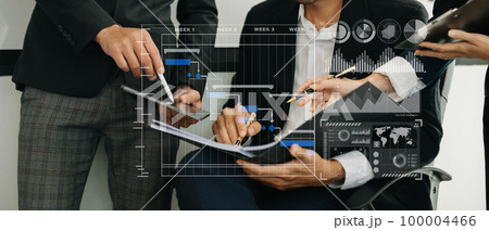 Businessman hand Project manager working and update tasks and Gantt chart scheduling virtual diagram.with smart phone, tablet and laptop in office.. 100004466