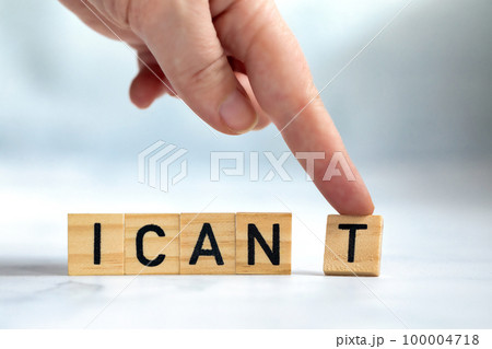 Change the word I can't to read I can concept for self belief, positive attitude and motivation, Hand removing the can't text wooden cubes background texture 100004718