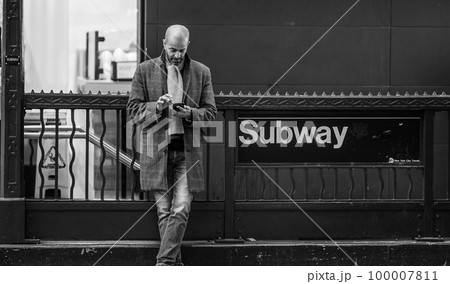 Man waiting at the subway entrance - travel photography Man waiting at the subway entrance - travel photography 100007811