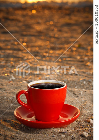 Red cup with coffee Red cup with coffee 100010553
