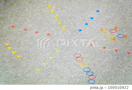 Kyiv, Ukraine November 19, 2022: Chips on the sports ground for the training of young football players Kyiv, Ukraine November 19, 2022: Chips on the sports ground for the training of young football players 100010922