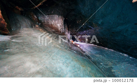 Turquoise pure color of ice inside the ice cave. 100012178