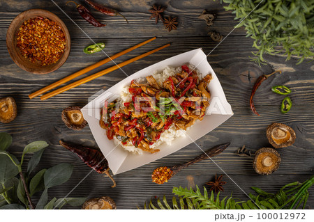 Top view of spicy chicken in sweet and sour sauce 100012972