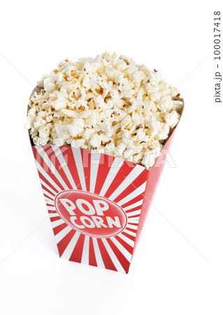 Popcorn in red and white striped cardboard bucket isolated on white background Popcorn in red and white striped cardboard bucket isolated on white background 100017418