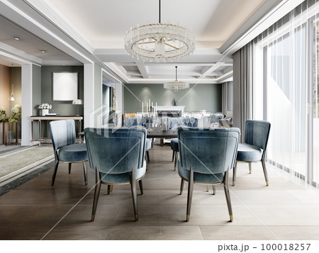 Dining in a modern living room with a trendy six-person dining table with blue upholstered chairs with a black granite server table. Dining in a modern living room with a trendy six-person dining table with blue upholstered chairs with a black granite server table. 100018257