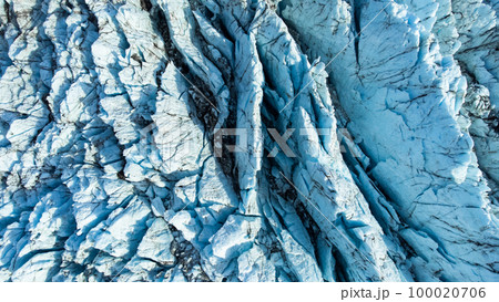 Huge glacier with pure blue ice at sunny weather. Vatnajokull glacier in Iceland. Beautiful nature abstract background. Ice texture landscape aerial view. 100020706
