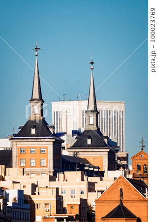 Telephoto view of Madrid skyline combining old buildings with modern skyscrapers Telephoto view of Madrid skyline combining old buildings with modern skyscrapers 100023769