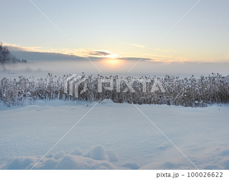 sunset over the winter lake sunset over the winter lake 100026622