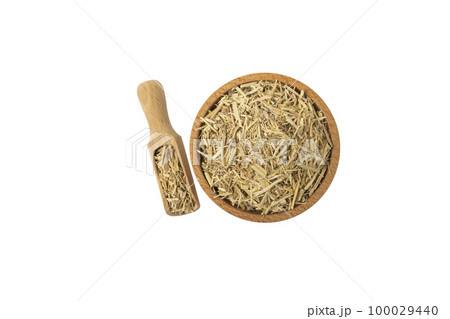 siberian ginseng in latin Eleutherococcus senticosus in wooden bowl and scoop isolated on white 100029440
