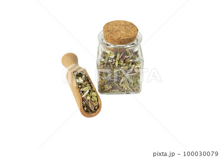 Catnip herb in latin - Nepeta cataria in wooden scoop and glass jar on isolated on white background. Medicinal herb. 100030079