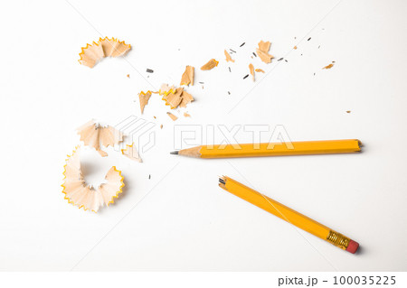 Broken pencil and shavings on white background, top view 100035225