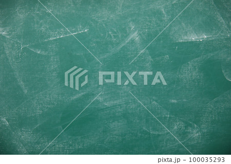 Dirty green chalkboard as background. Space for text 100035293