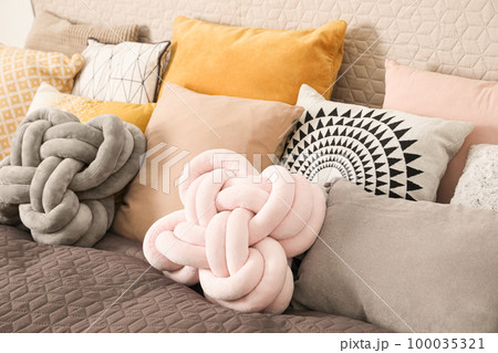 Large comfortable bed with many different pillows Large comfortable bed with many different pillows 100035321