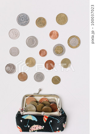 Open wallet with different coins isolated on white background top view. Financial crisis, poverty, lack of money concept Open wallet with different coins isolated on white background top view. Financial crisis, poverty, lack of money concept 100037023