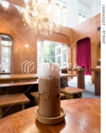 Iced coffee mocha on wooden table in coffee shop Iced coffee mocha on wooden table in coffee shop 100040697