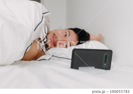 Man video call overnight sleeping on his bed from night to morning. Man video call overnight sleeping on his bed from night to morning. 100055783