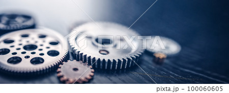 Different shapes cogwheels ling on the black background. Different shapes cogwheels ling on the black background. 100060605