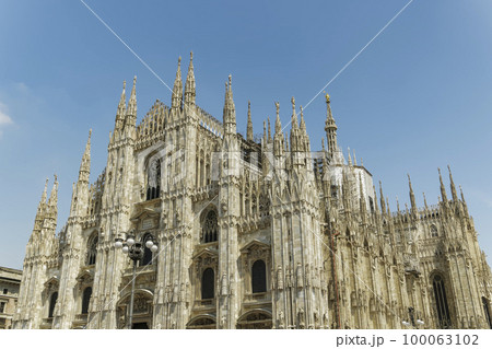 Milan, Italy Duomo di Milano front and side view. External day view of the Roman Catholic cathedral church of Milan. Milan, Italy Duomo di Milano front and side view. External day view of the Roman Catholic cathedral church of Milan. 100063102