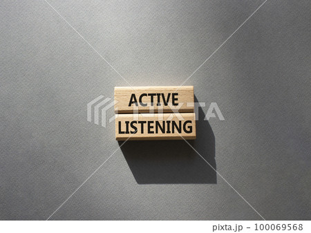 Active listening symbol. Wooden blocks with words Active listening. Beautiful grey background. Business and Active listening concept. Copy space. 100069568