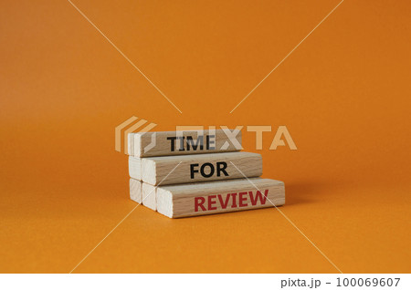 Time for Review symbol. Wooden blocks with words Time for Review. Beautiful orange background. Business and Time for Review concept. Copy space. 100069607