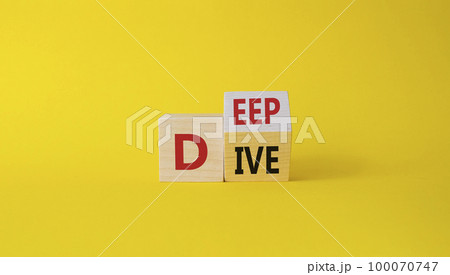 Deep Dive symbol. Concept words deep dive on wooden cubes. Beautiful yellow background. Business and Deep Dive concept. Copy space 100070747