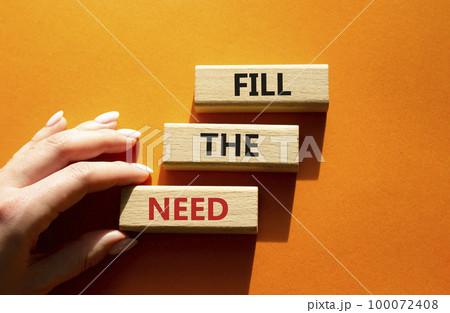 Fill the need symbol. Concept word Fill the need on wooden blocks. Beautiful orange background. Businessman hand. Business and Fill the need concept. Copy space Fill the need symbol. Concept word Fill the need on wooden blocks. Beautiful orange background. Businessman hand. Business and Fill the need concept. Copy space 100072408