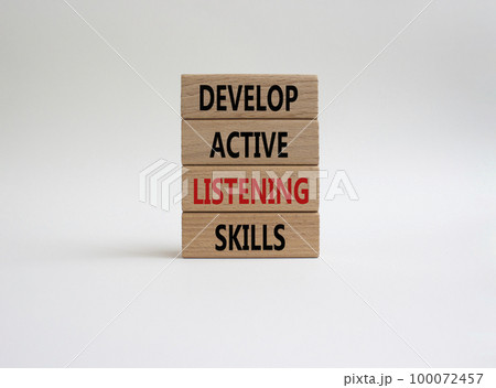 Listening skills symbol. Concept word Develop active listening skills on wooden blocks. Beautiful white background. Business and Develop active listening skills concept. Copy space Listening skills symbol. Concept word Develop active listening skills on wooden blocks. Beautiful white background. Business and Develop active listening skills concept. Copy space 100072457